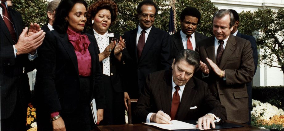 Ronald Reagan and Coretta Scott King at the Martin Luther King Jr. Day signing ceremony