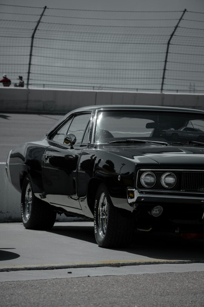 Few cars scream Mopar muscle like the 1969 Dodge Charger RT. With its signature fastback styling, hidden headlights, and wide stance, t