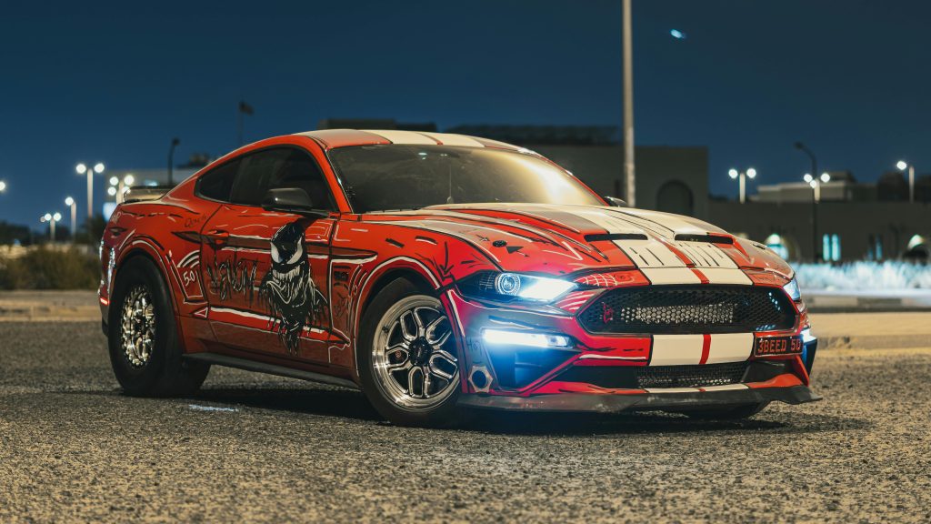 What are some charitable efforts that are associated with the woodward dream cruise detroit car show