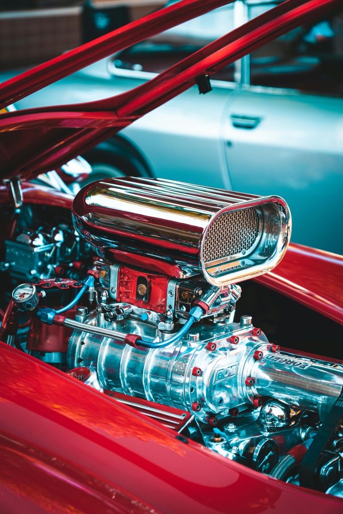 What are the most iconic classic American muscle cars seen on Woodward Avenue